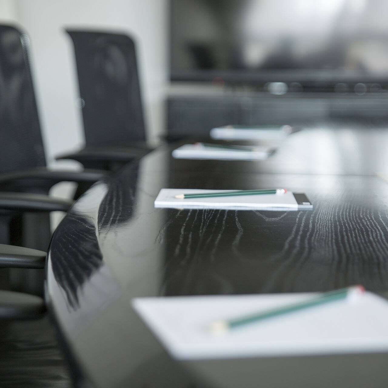 Nonprofit-board-meeting-conference-room board room with empty chairs