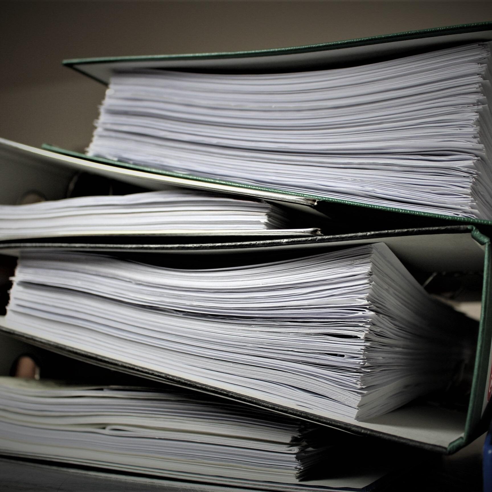 Pile-of-paperwork binder full of paper